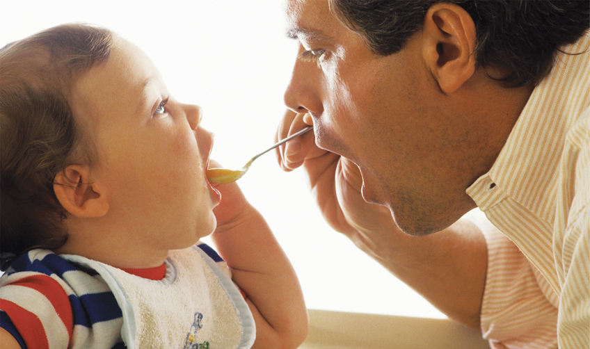 father feeding baby Solid-food