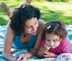 Mom reading to her daughter