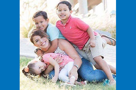 Siblings with mom in park