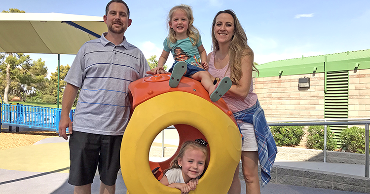 Family of four on playground