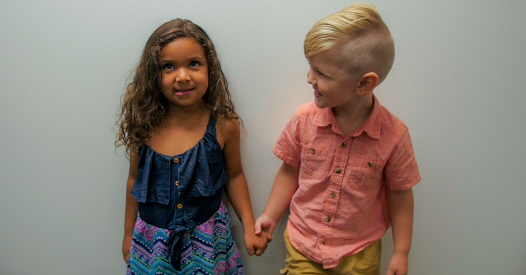 girl and boy holding hands