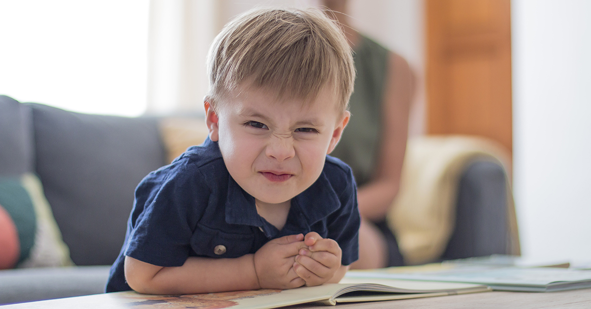 little boy frowning