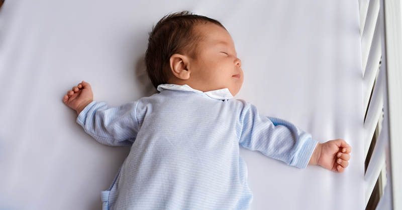 baby sleeping on his back