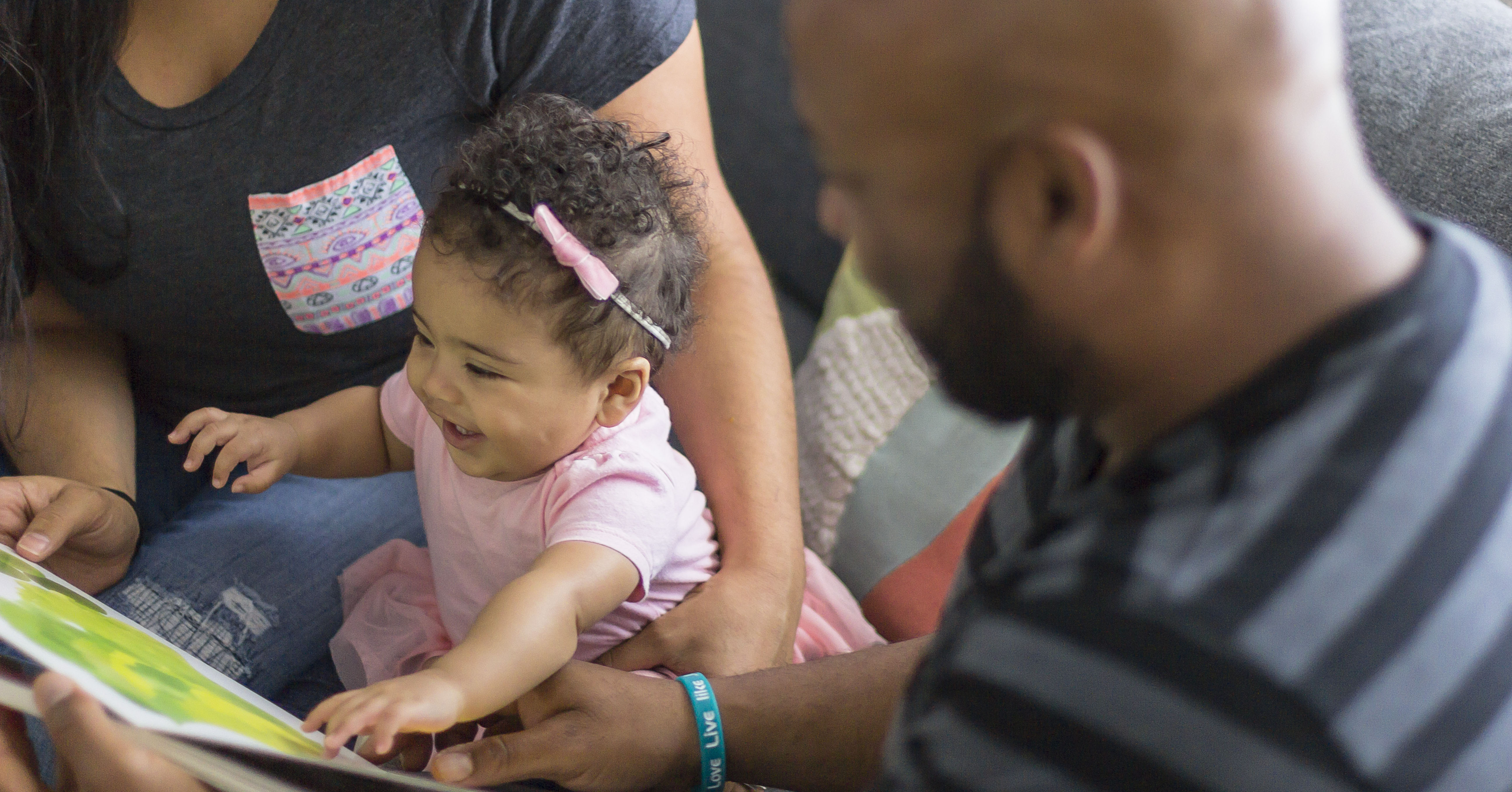 family reading with young child