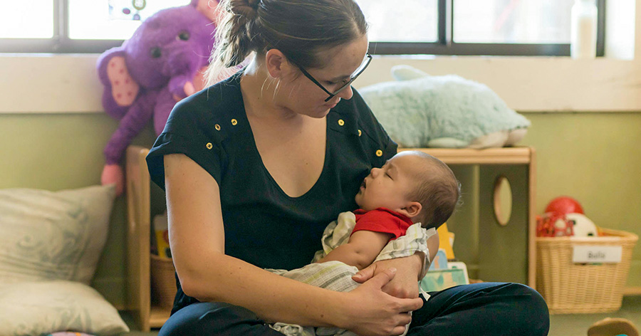 mom holding small baby