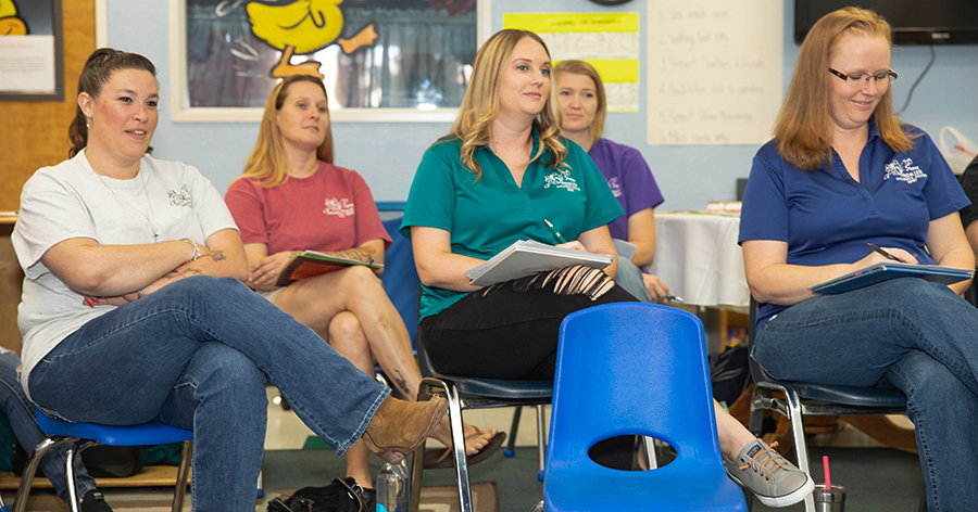 early educators sitting in professional development class