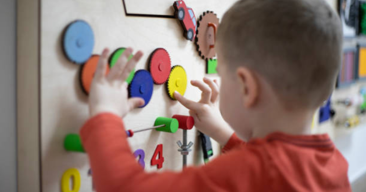 boy playing with toys at child care