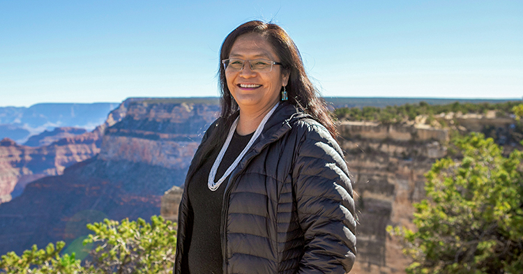 Carletta Tilousi standing at the Grand Canyon