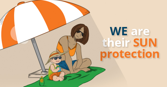 Mom and toddler sitting underneath a sun shade umbrella